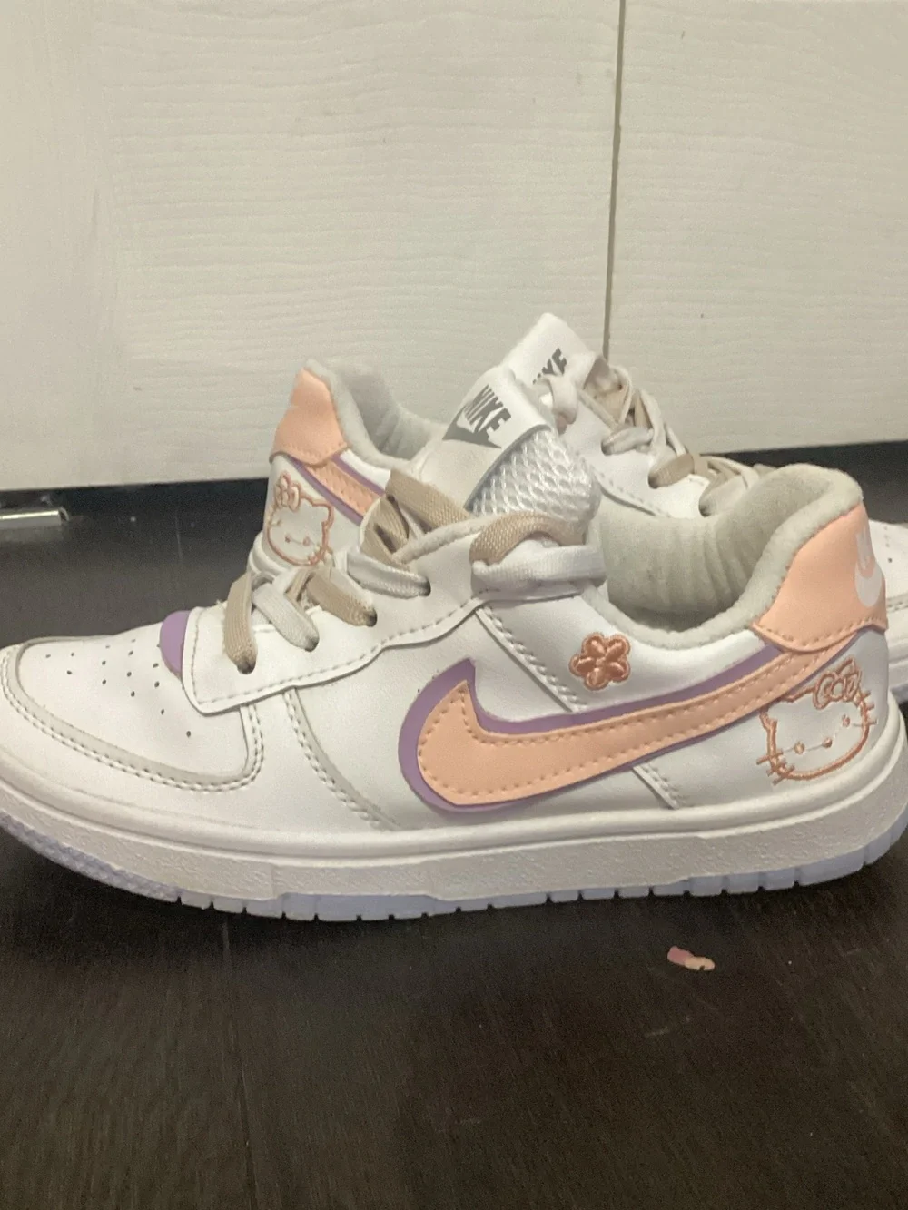 Nike Kids White Sneakers with Pastel Purple and Peach Accents